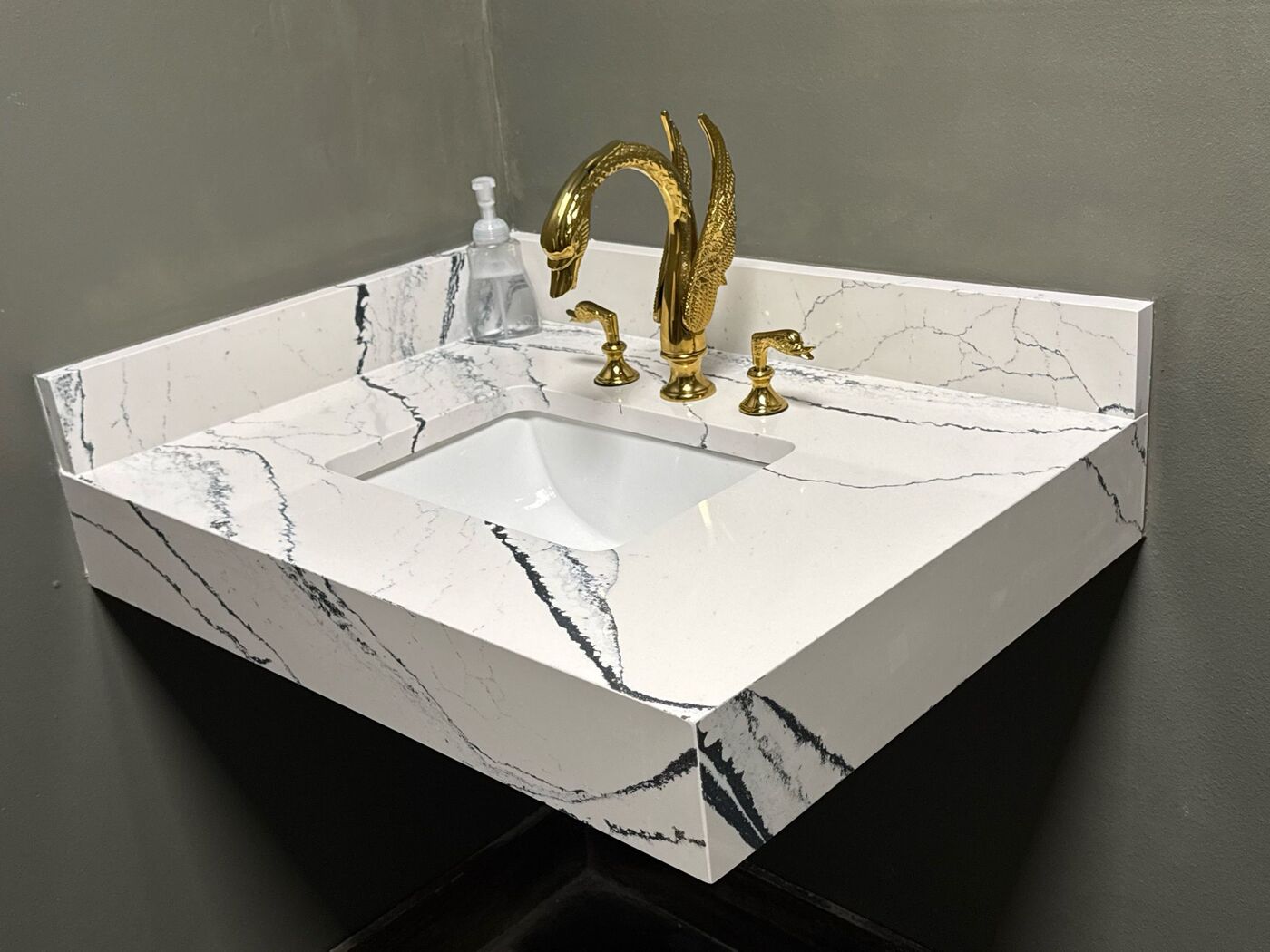 Floating marble vanity with brass fittings